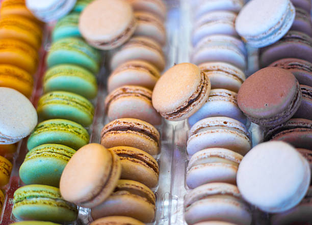 colorful macarons in bakery window