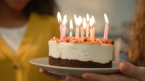happy couple holding cake