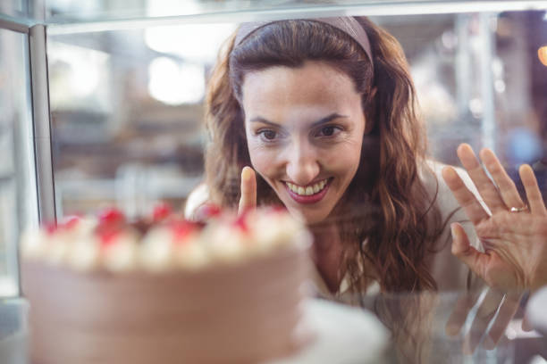 Customer admiring cake display