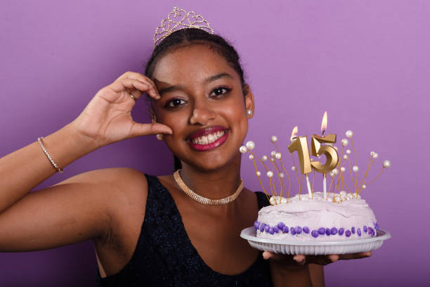 teen holding birthday cake